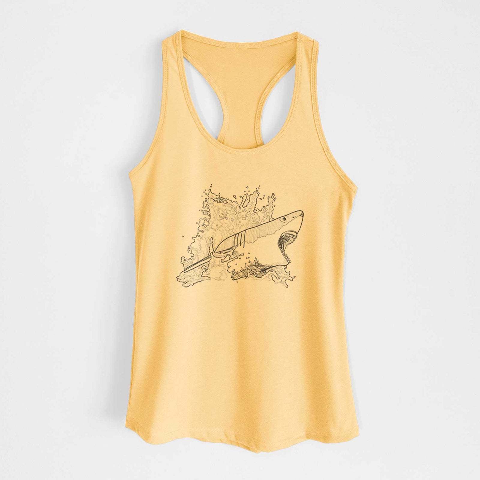 Banana cream women's racerback tank top laid flat, printed with a black ink illustration of a great white shark breaking through a splash of water.
