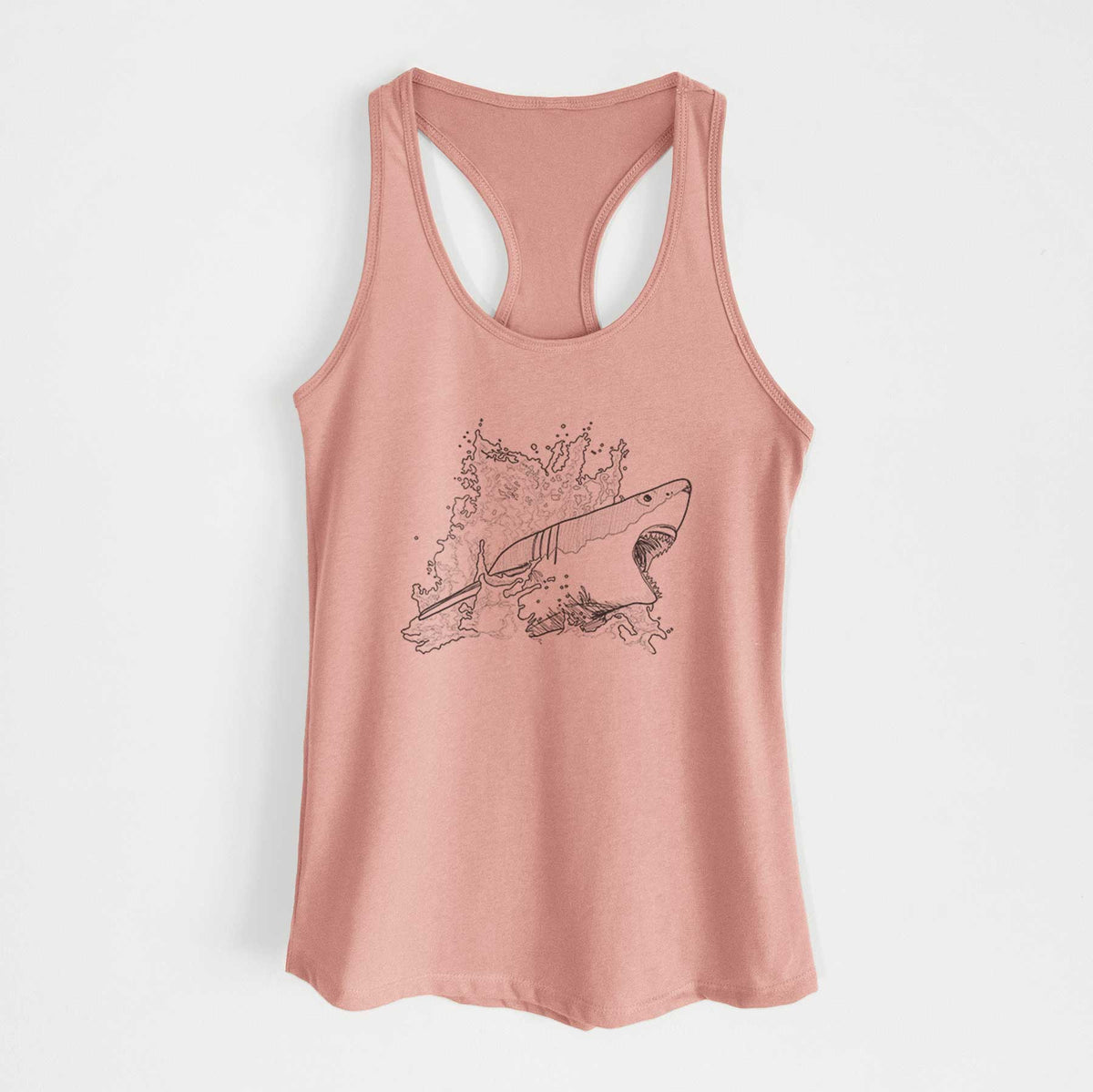Desert pink women's racerback tank top laid flat, printed with a black ink illustration of a great white shark breaking through a splash of water.