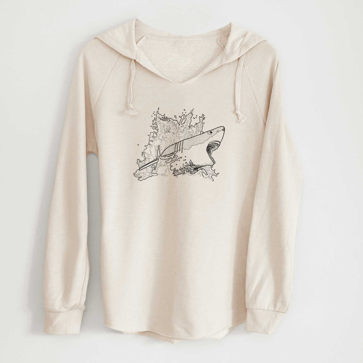 Bone cream women's Cali Wave hooded sweatshirt laid flat, printed with a black ink illustration of a great white shark breaking through a splash of water.