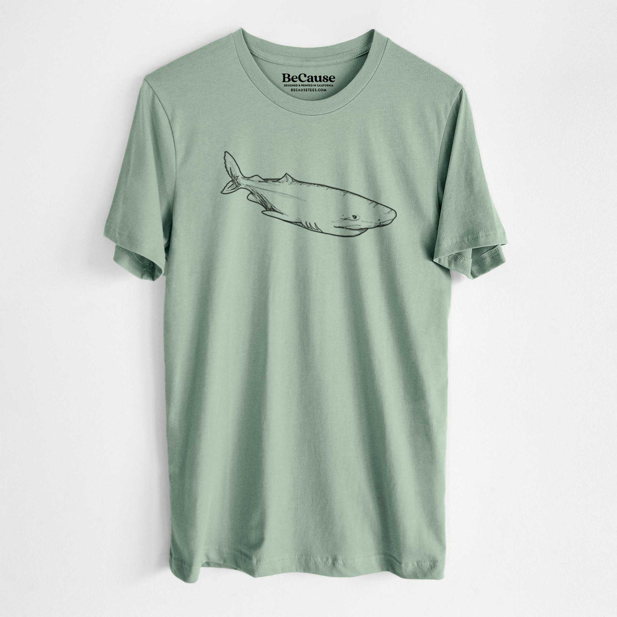 Sage green lightweight cotton t-shirt laid flat, printed with a black ink illustration of a Greenland shark swimming.