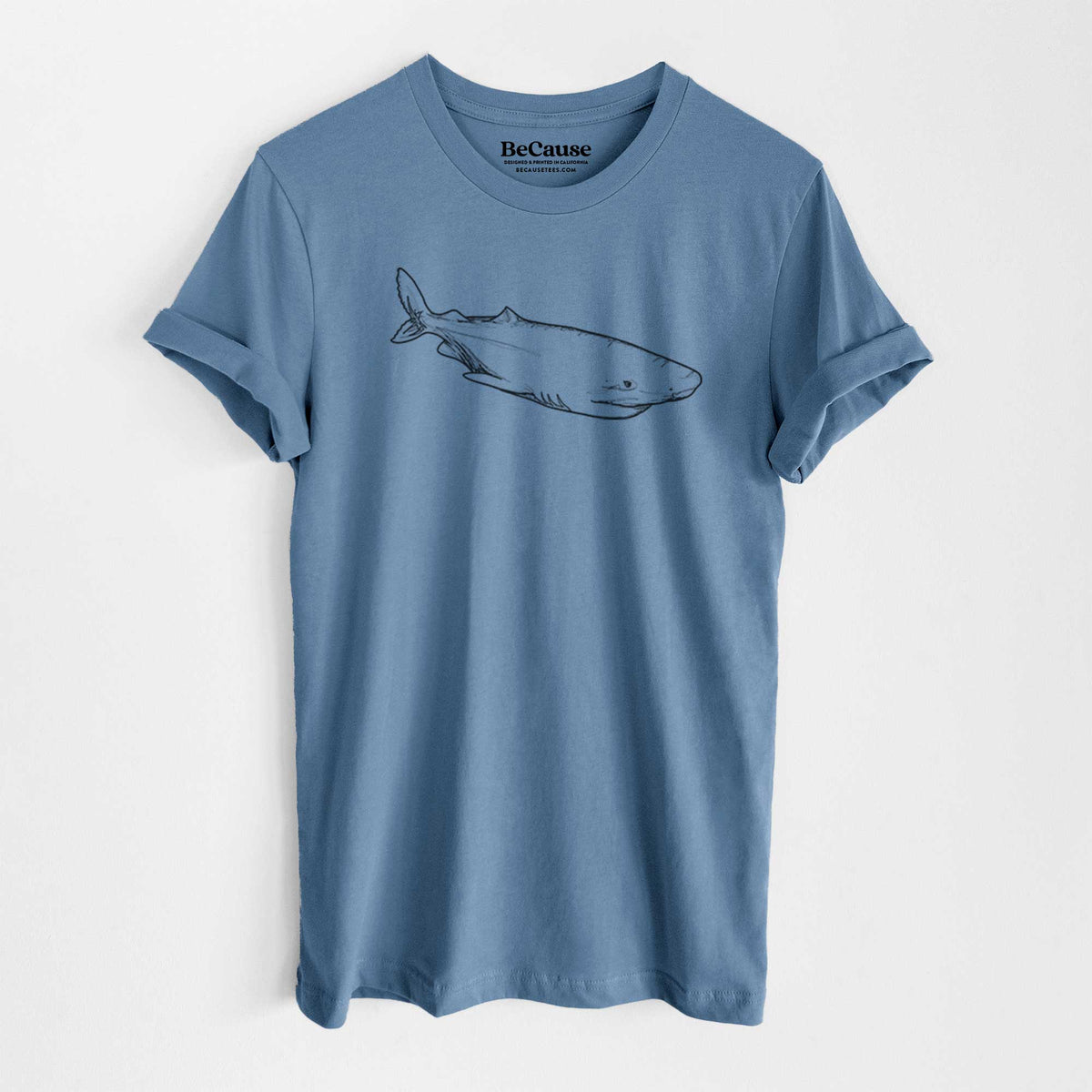 Steel blue lightweight cotton t-shirt laid flat, printed with a black ink illustration of a Greenland shark swimming.
