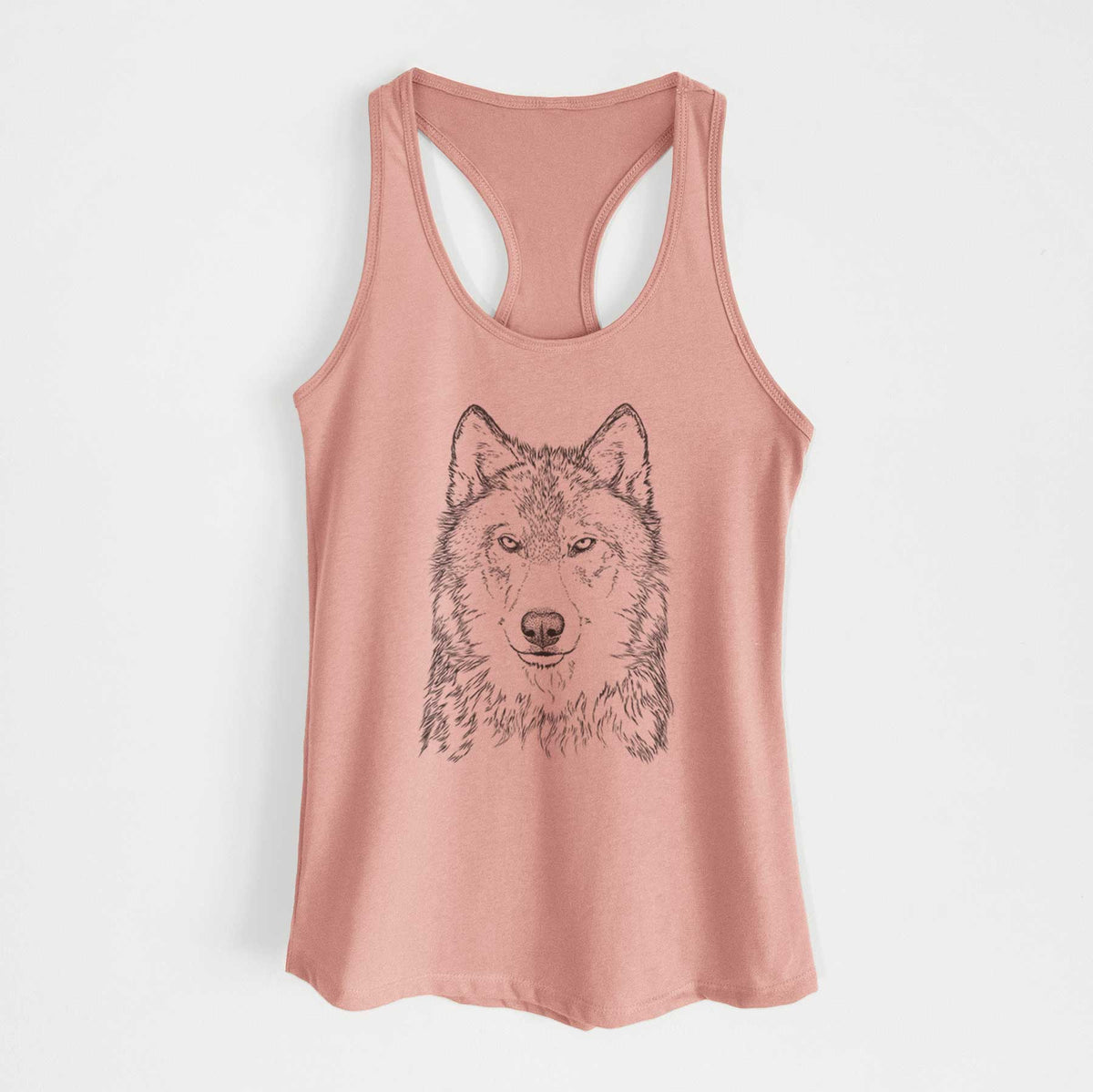 Desert pink women's racerback tank top laid flat, printed with a detailed black ink portrait of a grey wolf facing forward.
