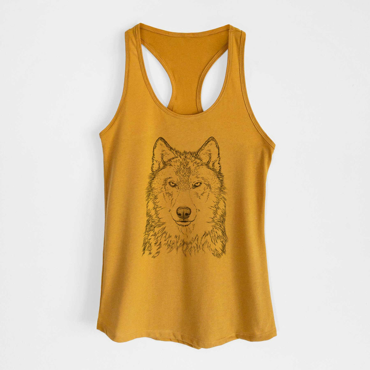 Gold women's racerback tank top laid flat, printed with a detailed black ink portrait of a grey wolf facing forward.