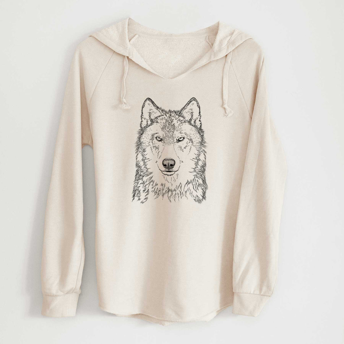 Bone cream women's Cali Wave hooded sweatshirt laid flat, printed with a detailed black ink portrait of a grey wolf facing forward.
