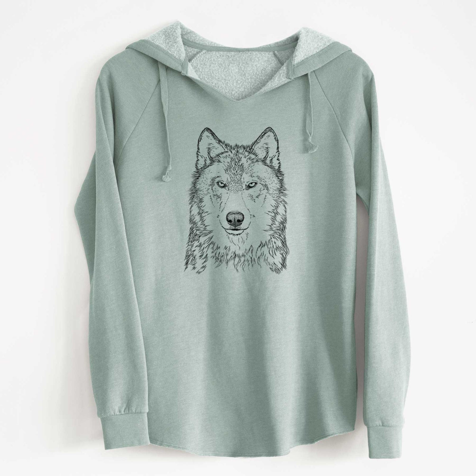 Sage green women's Cali Wave hooded sweatshirt laid flat, printed with a detailed black ink portrait of a grey wolf facing forward.