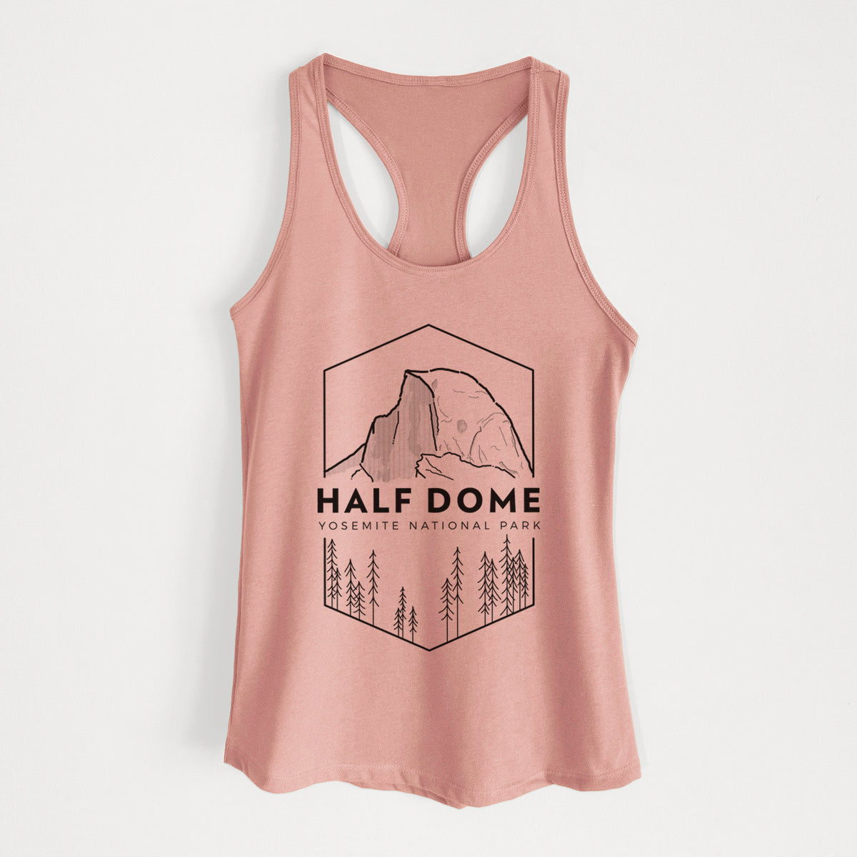 Desert pink women's racerback tank top laid flat, printed with a black line art badge of Half Dome above a pine forest, with the words Half Dome, Yosemite National Park.