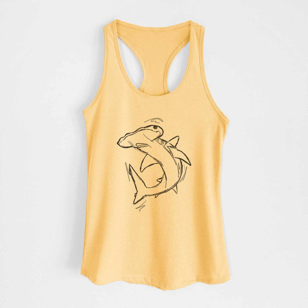 Banana cream women's racerback tank top laid flat, printed with a black ink illustration of a hammerhead shark swimming in a curve.
