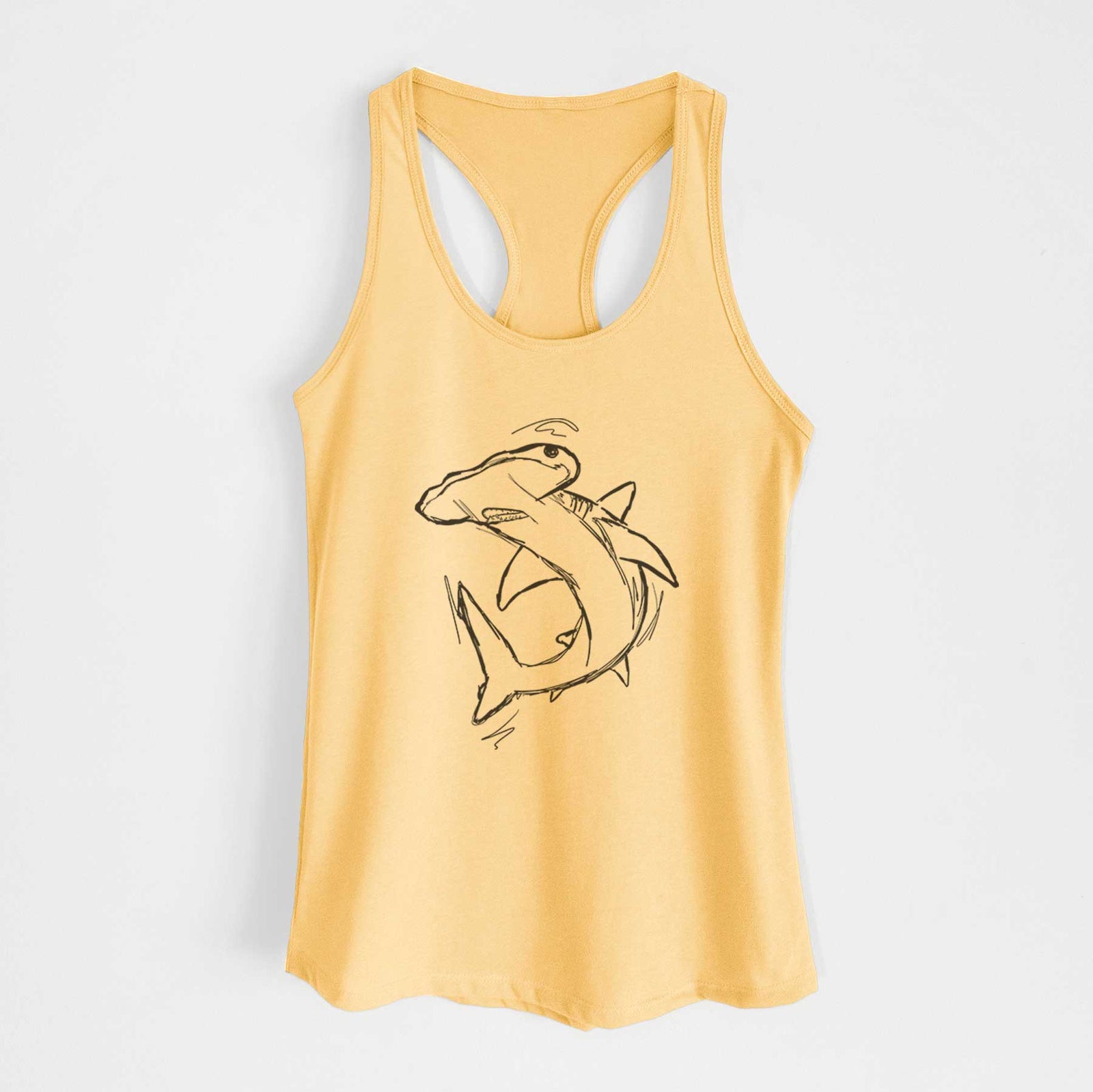 Banana cream women's racerback tank top laid flat, printed with a black ink illustration of a hammerhead shark swimming in a curve.