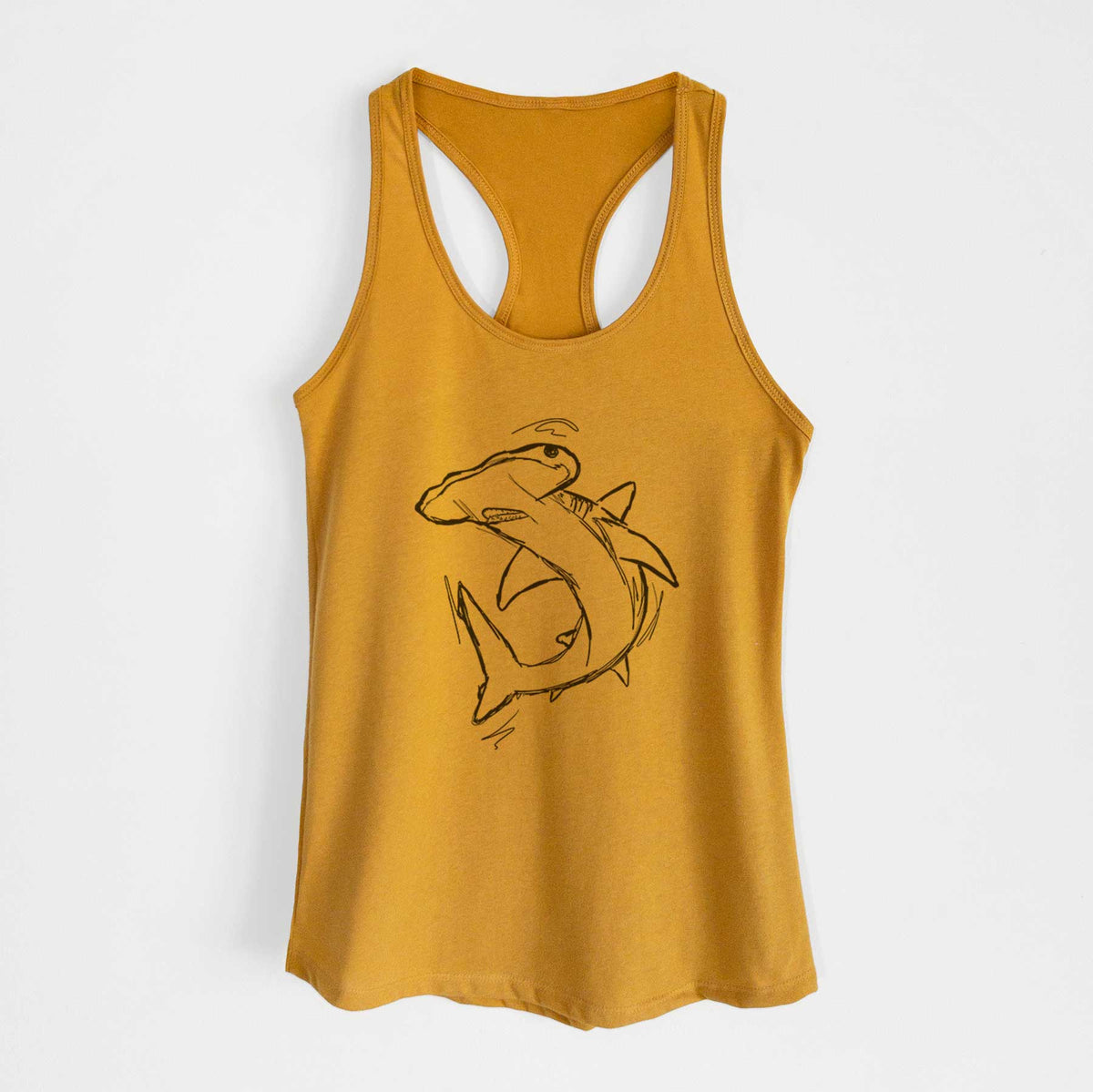 Gold women's racerback tank top laid flat, printed with a black ink illustration of a hammerhead shark swimming in a curve.