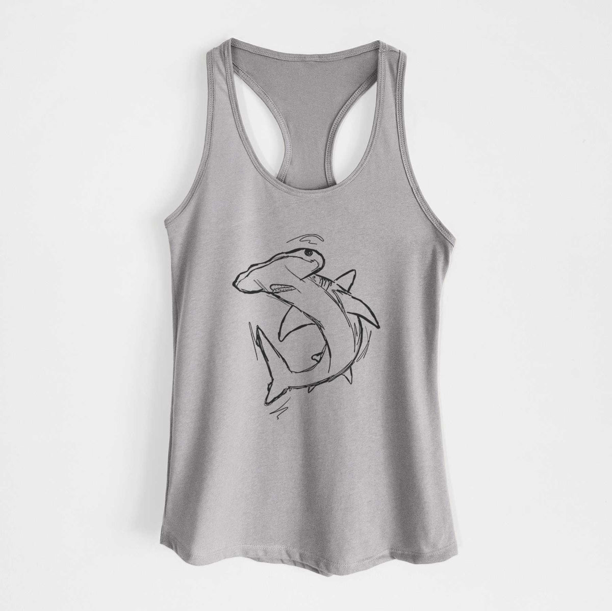 Heather grey women's racerback tank top laid flat, printed with a black ink illustration of a hammerhead shark swimming in a curve.