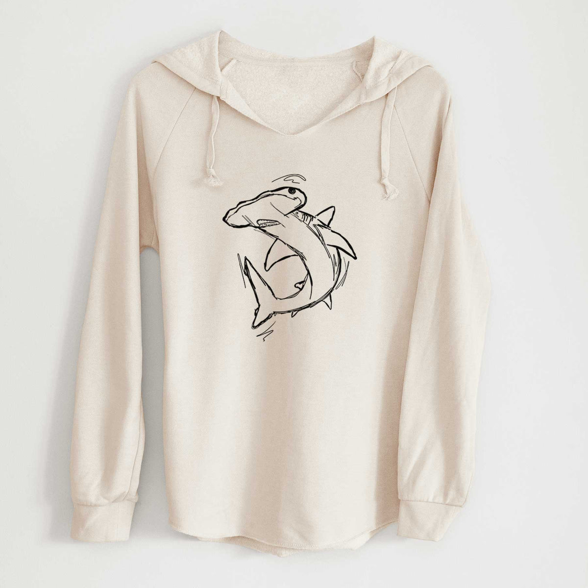 Bone cream women's Cali Wave hooded sweatshirt laid flat, printed with a black ink illustration of a hammerhead shark swimming in a curve.