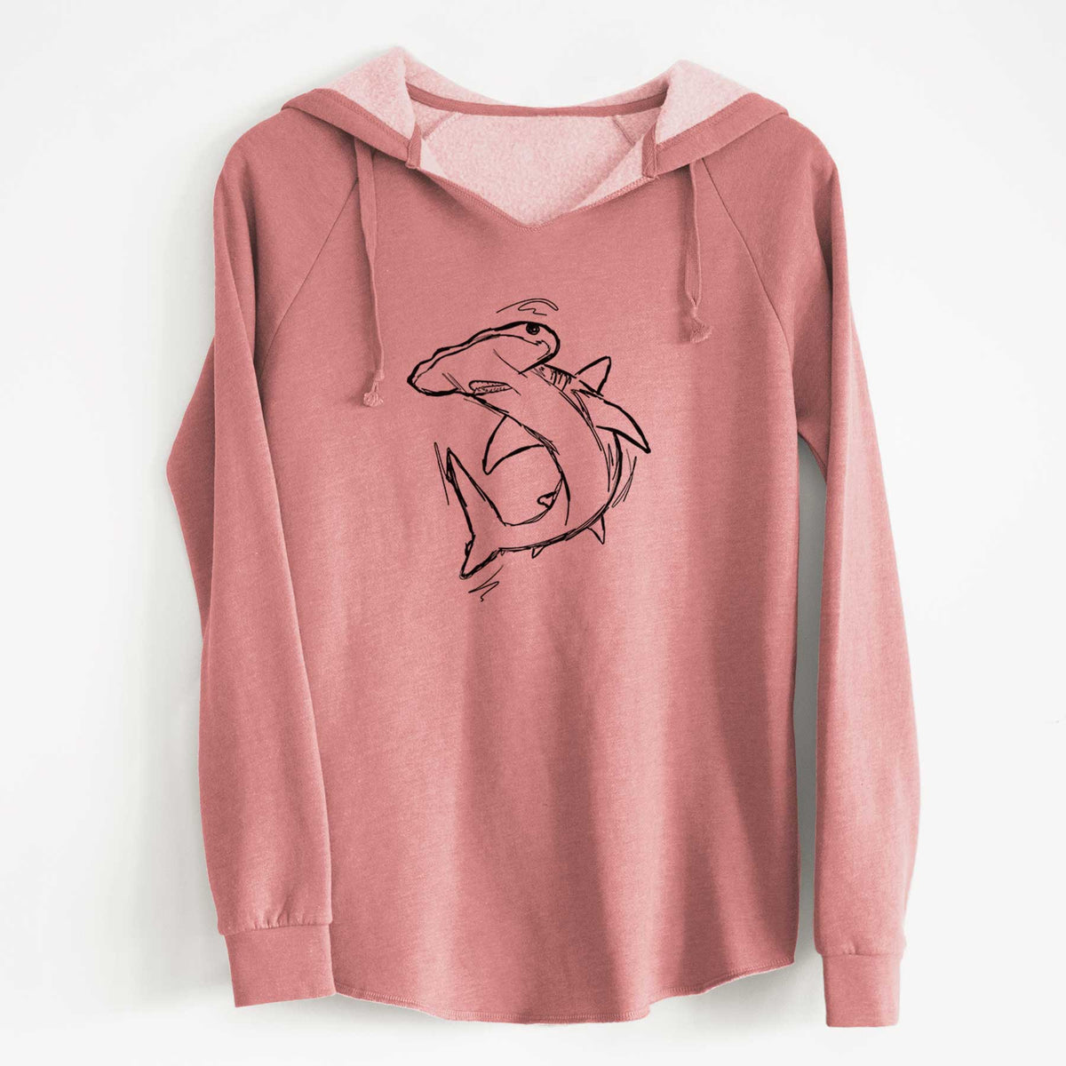 Dusty rose women's Cali Wave hooded sweatshirt laid flat, printed with a black ink illustration of a hammerhead shark swimming in a curve.
