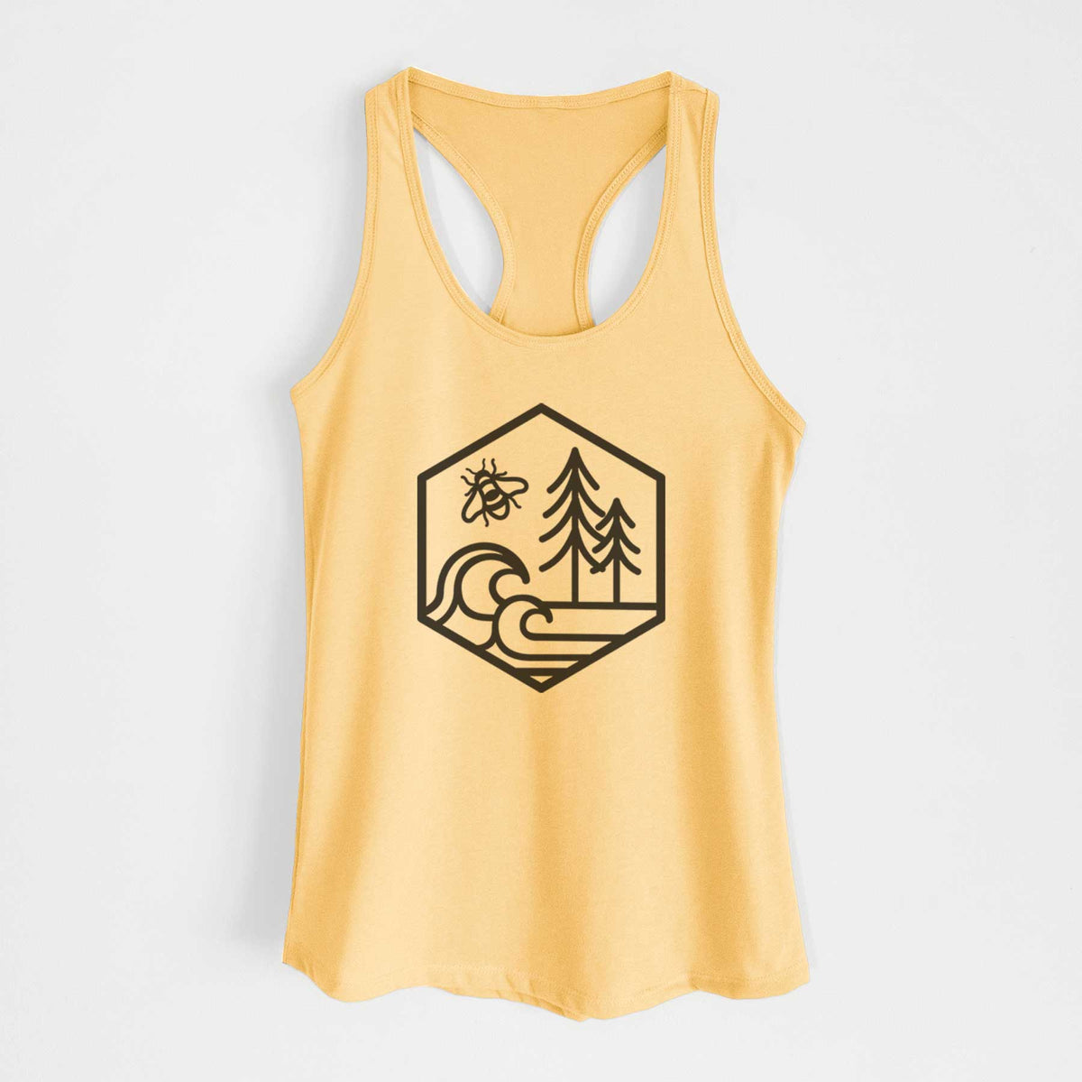 Banana cream women's racerback tank top laid flat, printed with a black line art hexagon holding a bee, ocean waves and pine trees.
