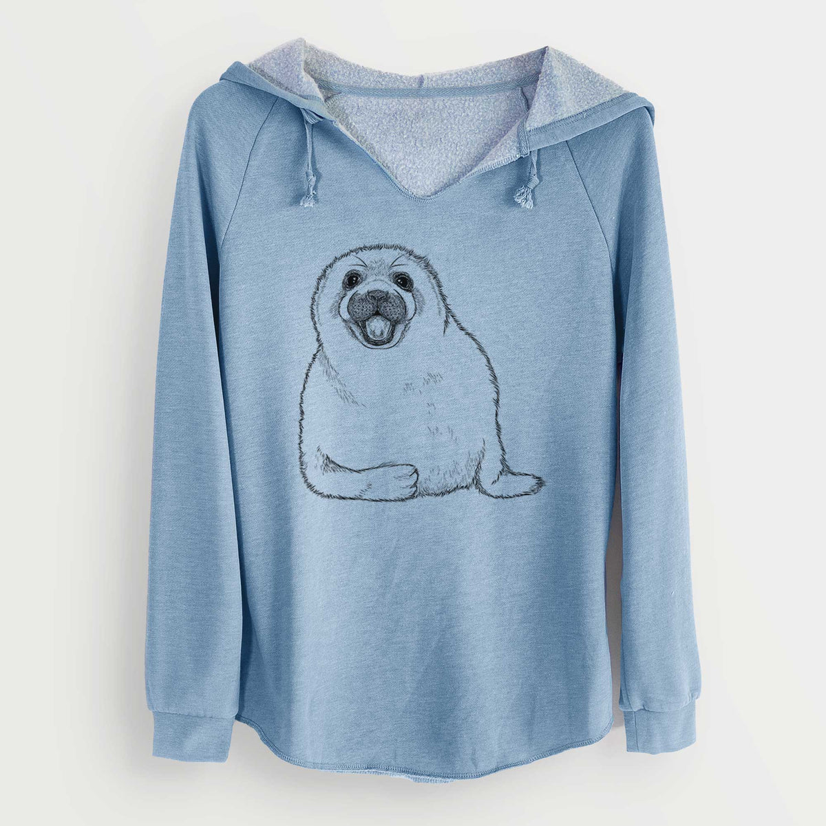Misty blue women's Cali Wave hooded sweatshirt laid flat, printed with a black ink illustration of a smiling harp seal pup lying down.