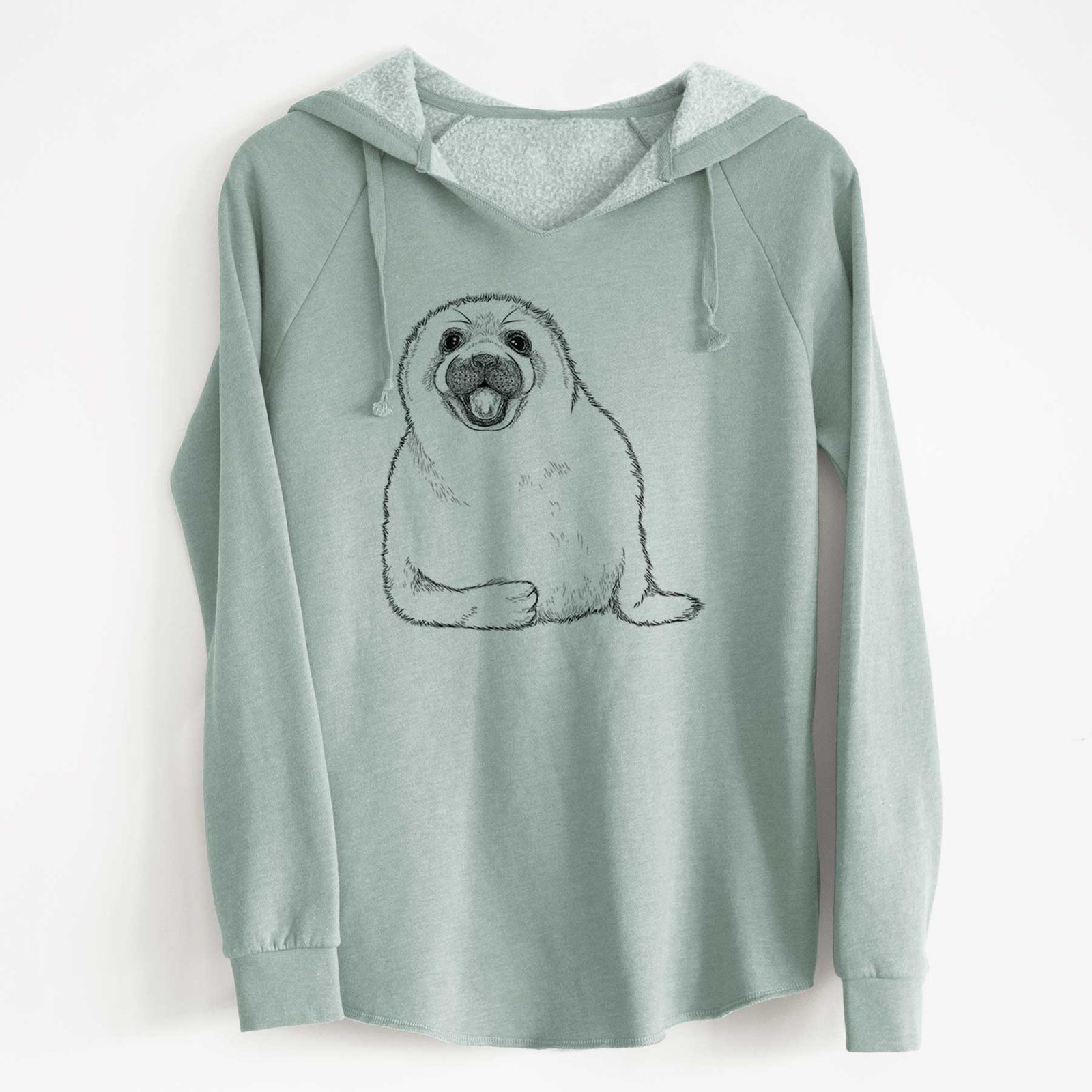 Sage green women's Cali Wave hooded sweatshirt laid flat, printed with a black ink illustration of a smiling harp seal pup lying down.