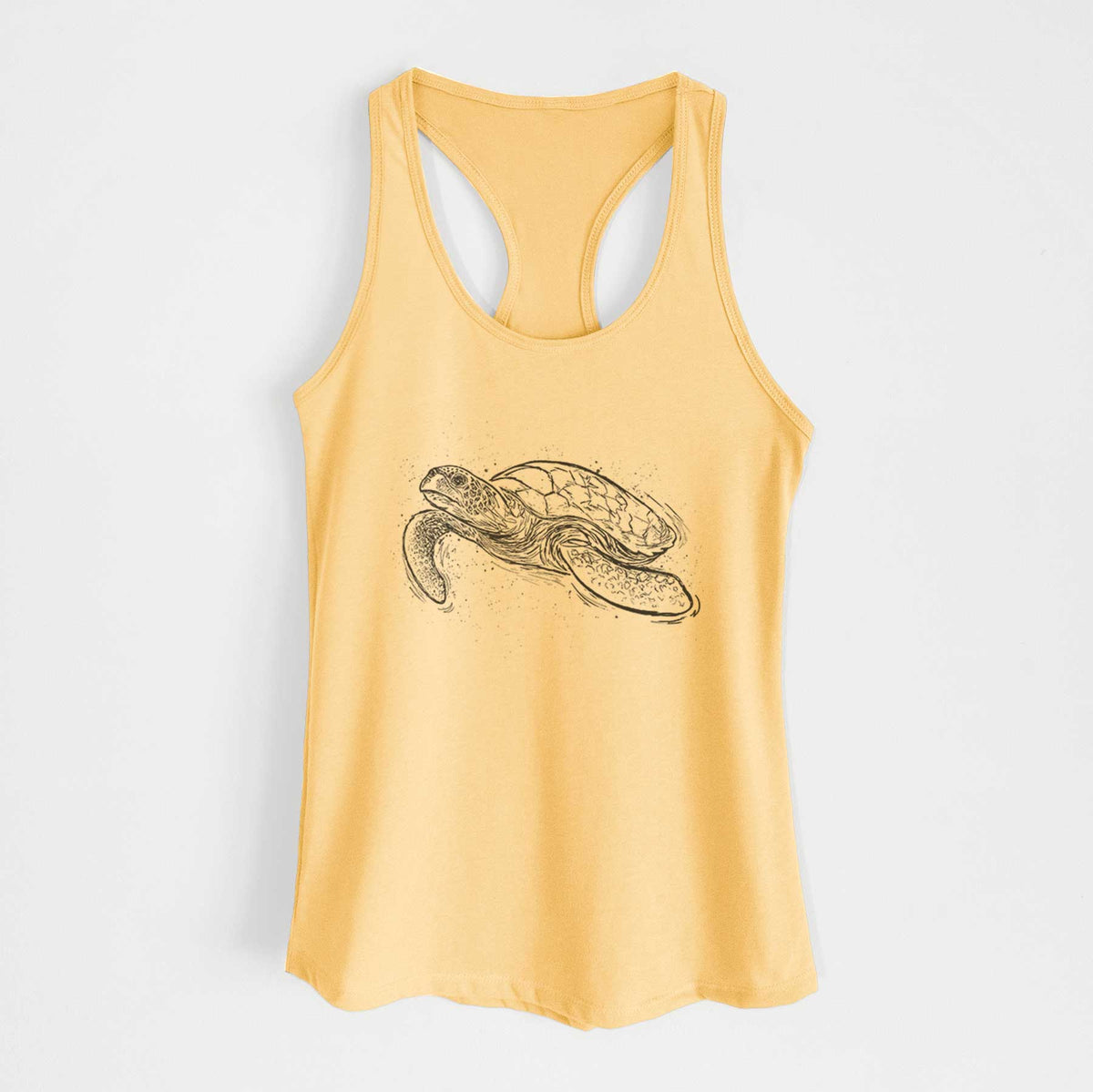 Banana cream women's racerback tank top laid flat, printed with a black ink illustration of a hawksbill sea turtle swimming, with a patterned shell.