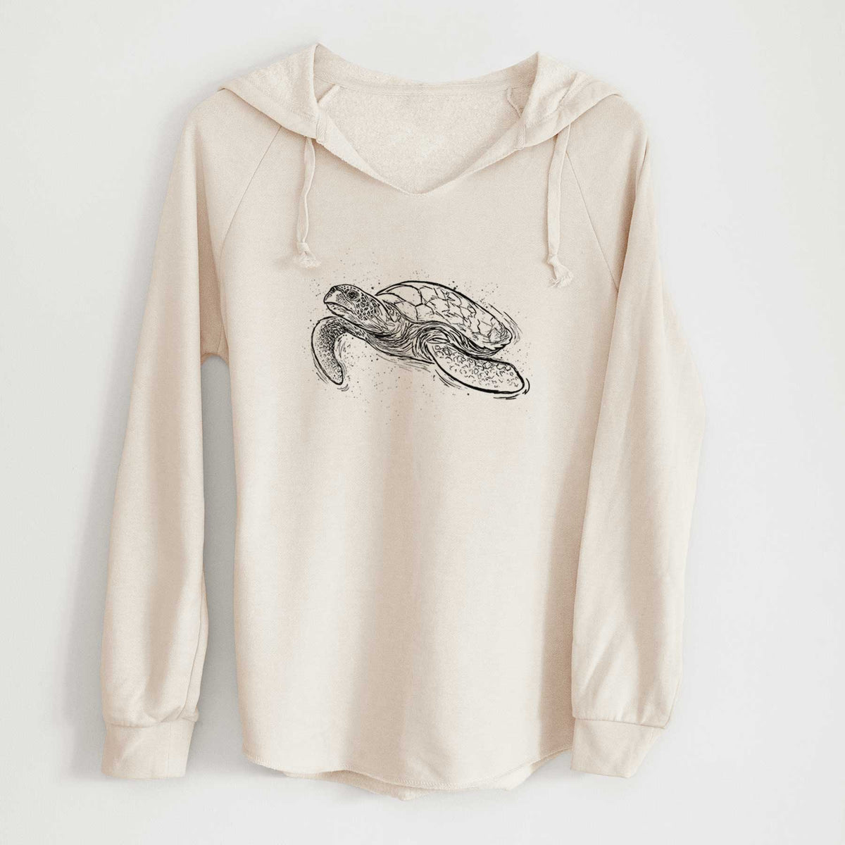 Bone cream women's Cali Wave hooded sweatshirt laid flat, printed with a black ink illustration of a hawksbill sea turtle swimming, with a patterned shell.