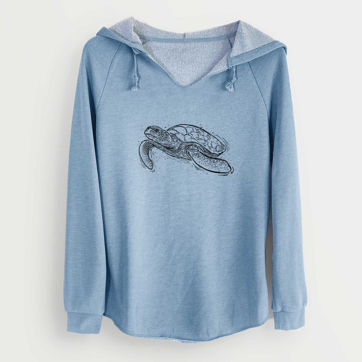 Misty blue women's Cali Wave hooded sweatshirt laid flat, printed with a black ink illustration of a hawksbill sea turtle swimming, with a patterned shell.