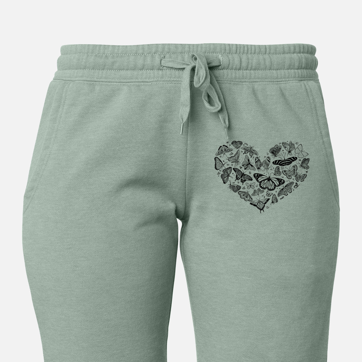 Front of sage green Cali Wave sweatpants, printed with a heart shape filled with small black ink butterflies and moths on the leg.
