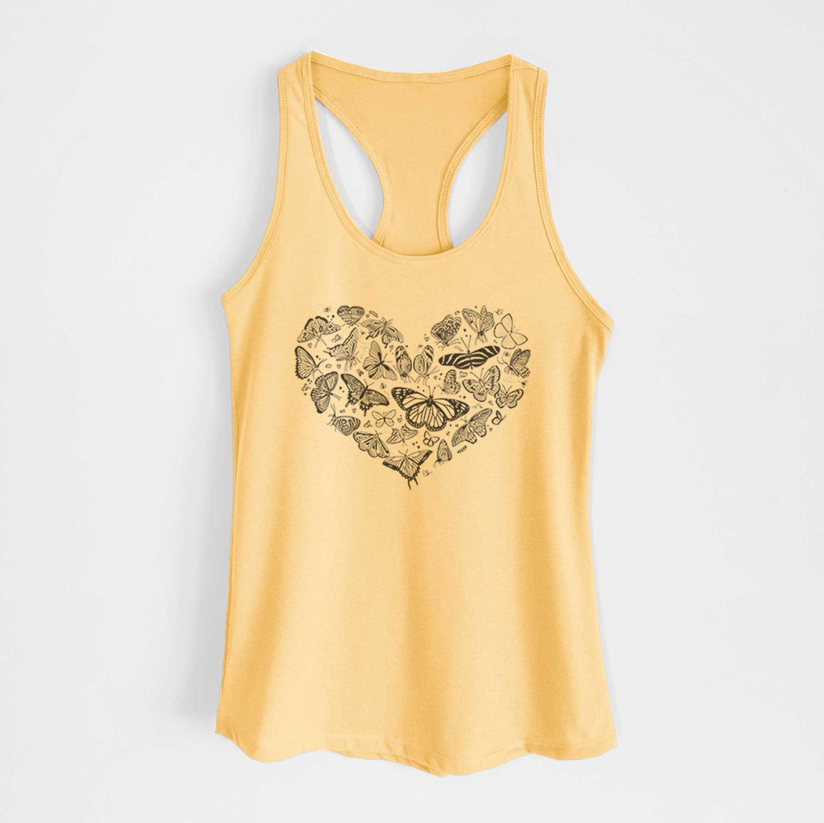 Banana cream women's racerback tank top laid flat, printed with a heart shape filled with small black ink butterflies and moths.