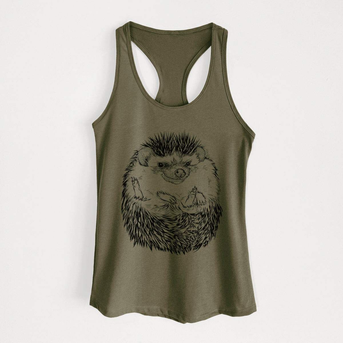 Military green women's racerback tank top laid flat, printed with a detailed black ink illustration of a hedgehog curled up and facing forward.