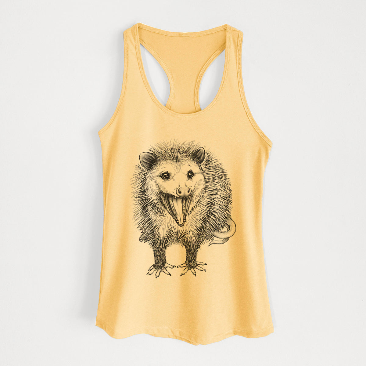 Banana cream women's racerback tank top laid flat, printed with a detailed black ink illustration of an opossum standing and facing forward, mouth open wide in a hiss, with shaggy fur and its tail curled behind.