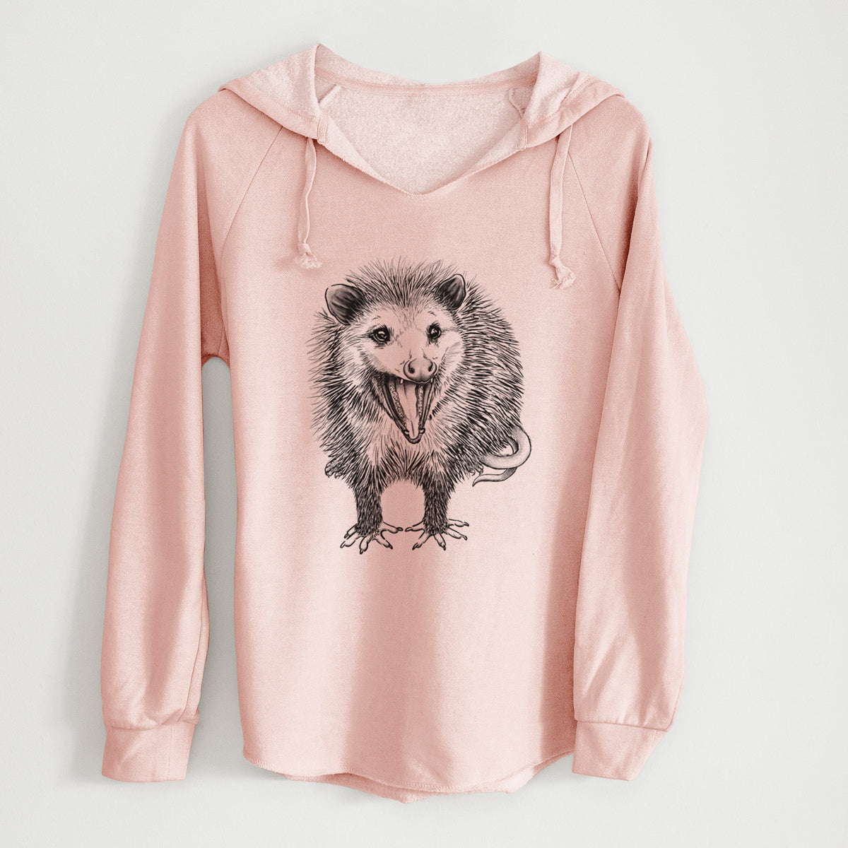 Blush pink women's Cali Wave hooded sweatshirt laid flat, with a crossover hood, drawcords and curved hem, printed with a detailed black ink illustration of an opossum standing and facing forward, mouth open wide in a hiss, with shaggy fur and its tail curled behind.
