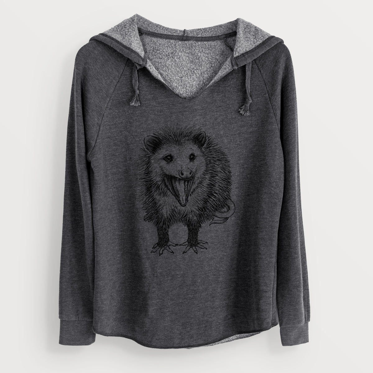 Charcoal grey women's Cali Wave hooded sweatshirt laid flat, with a crossover hood, drawcords and curved hem, printed with a detailed black ink illustration of an opossum standing and facing forward, mouth open wide in a hiss, with shaggy fur and its tail curled behind.