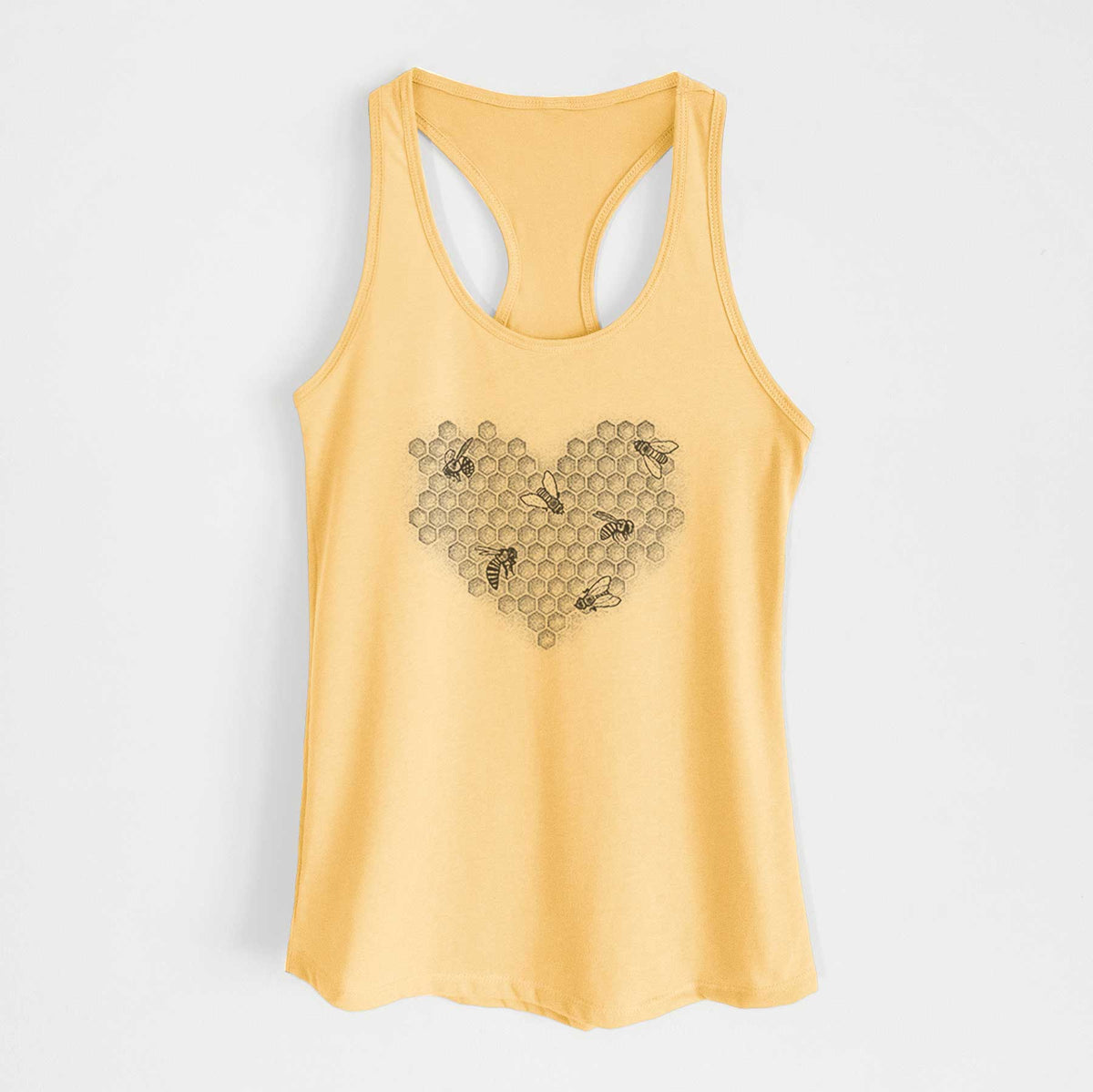 Banana cream women's racerback tank top laid flat, printed with a black ink heart made of honeycomb cells with small bees crawling across it.