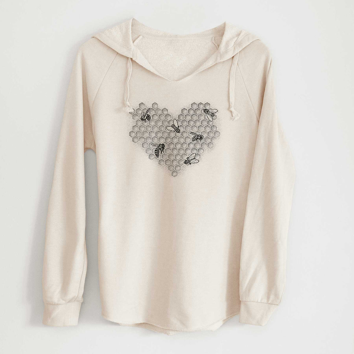Bone cream women's Cali Wave hooded sweatshirt laid flat, printed with a black ink heart made of honeycomb cells with small bees crawling across it.