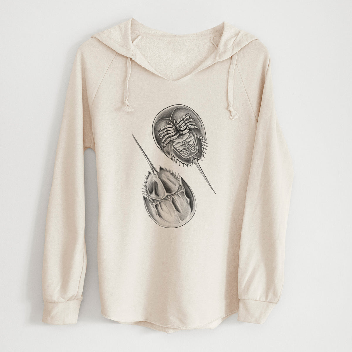 Bone cream women's Cali Wave hooded sweatshirt laid flat, printed with a detailed black ink illustration of two horseshoe crabs.