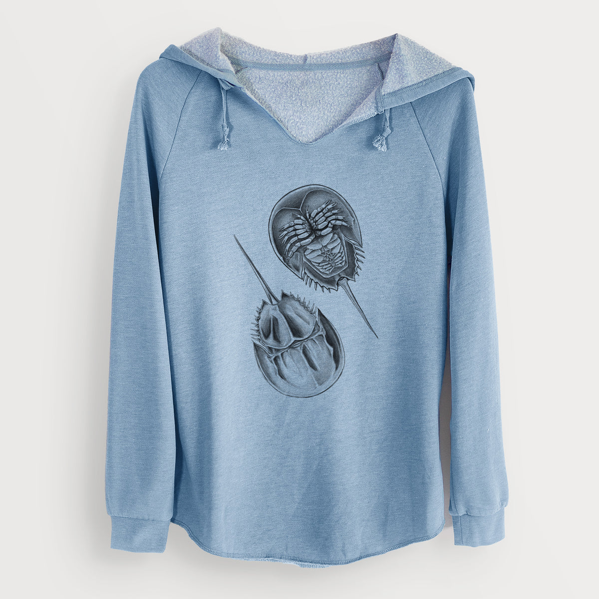 Misty blue women's Cali Wave hooded sweatshirt laid flat, printed with a detailed black ink illustration of two horseshoe crabs.