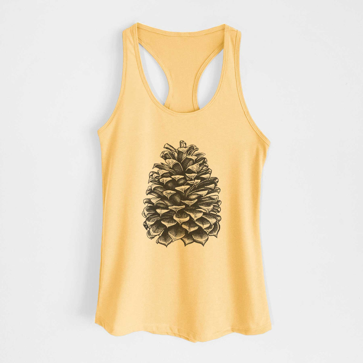Banana cream women's racerback tank top laid flat, printed with a detailed black ink illustration of a large Jeffrey pine cone.