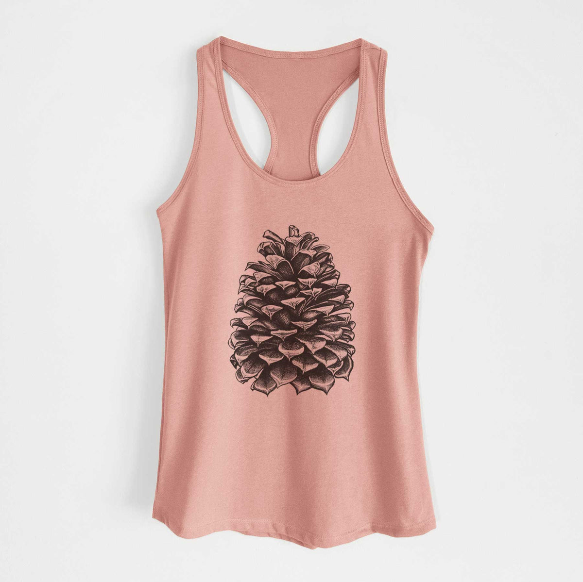 Desert pink women's racerback tank top laid flat, printed with a detailed black ink illustration of a large Jeffrey pine cone.