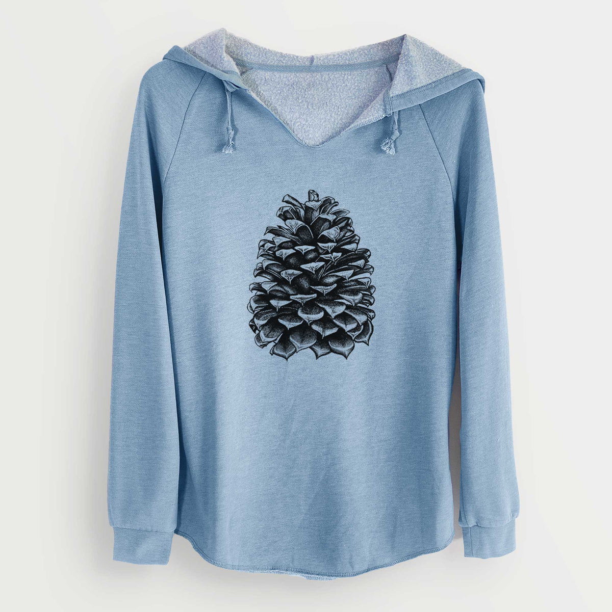 Misty blue women's Cali Wave hooded sweatshirt laid flat, printed with a detailed black ink illustration of a large Jeffrey pine cone.