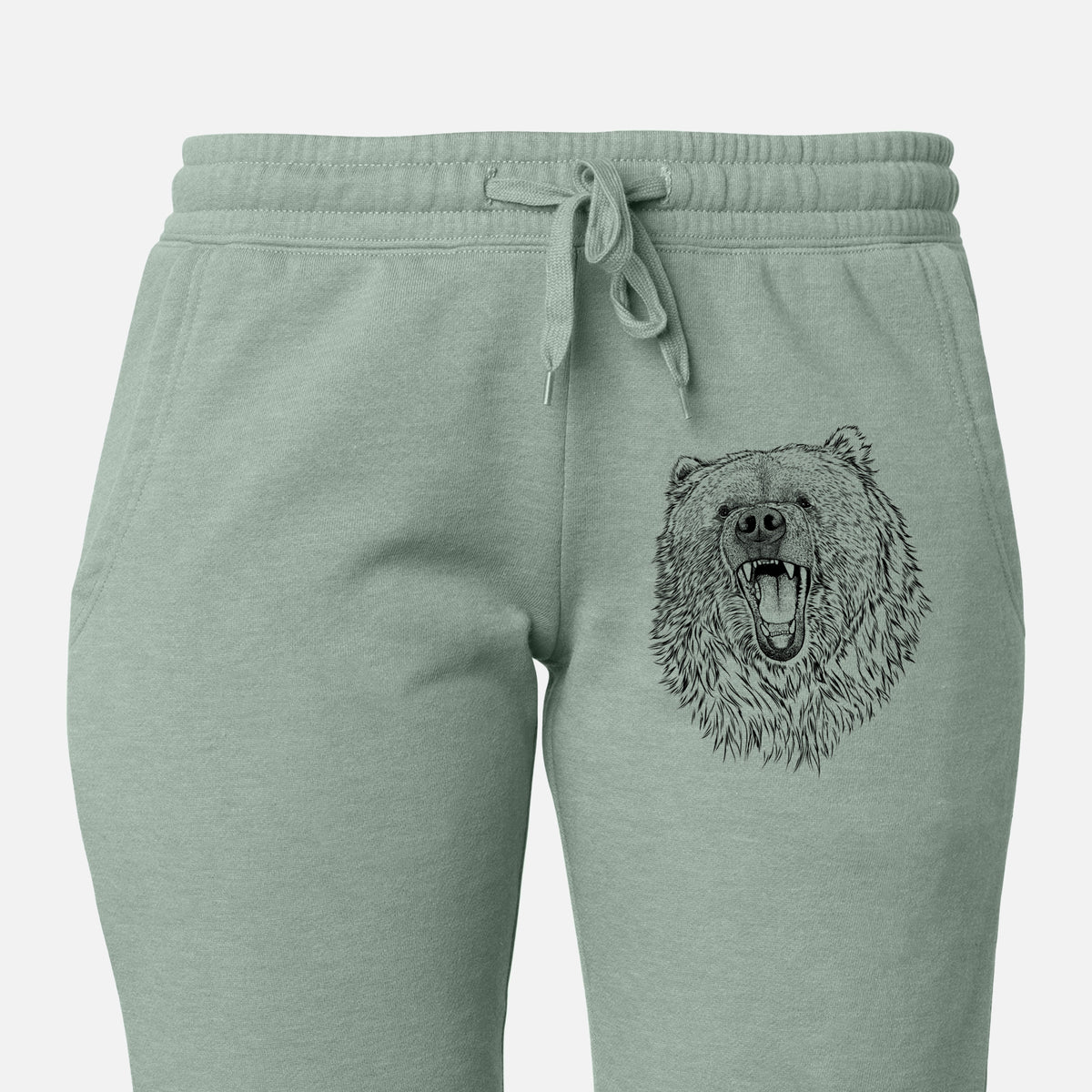 Front of sage green Cali Wave sweatpants, printed with a detailed black ink portrait of a roaring Kodiak bear facing forward on the leg.