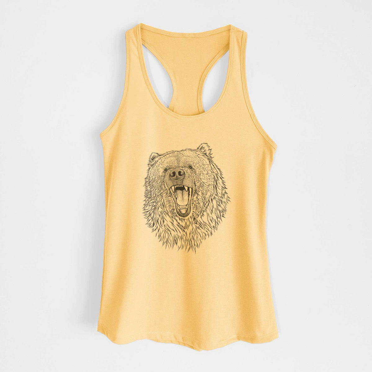 Banana cream women's racerback tank top laid flat, printed with a detailed black ink portrait of a roaring Kodiak bear facing forward.