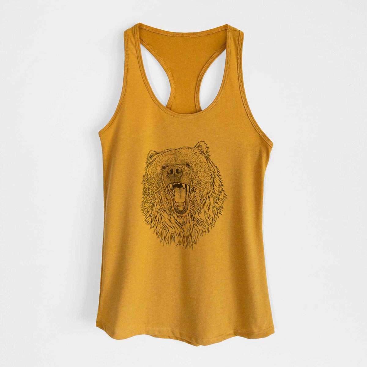 Gold women's racerback tank top laid flat, printed with a detailed black ink portrait of a roaring Kodiak bear facing forward.