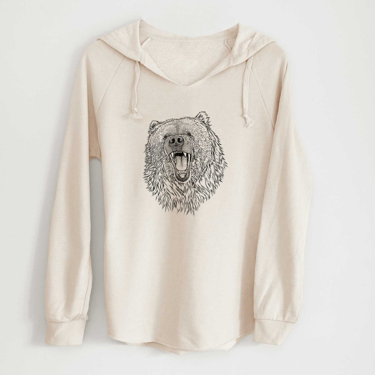 Bone cream women's Cali Wave hooded sweatshirt laid flat, printed with a detailed black ink portrait of a roaring Kodiak bear facing forward.