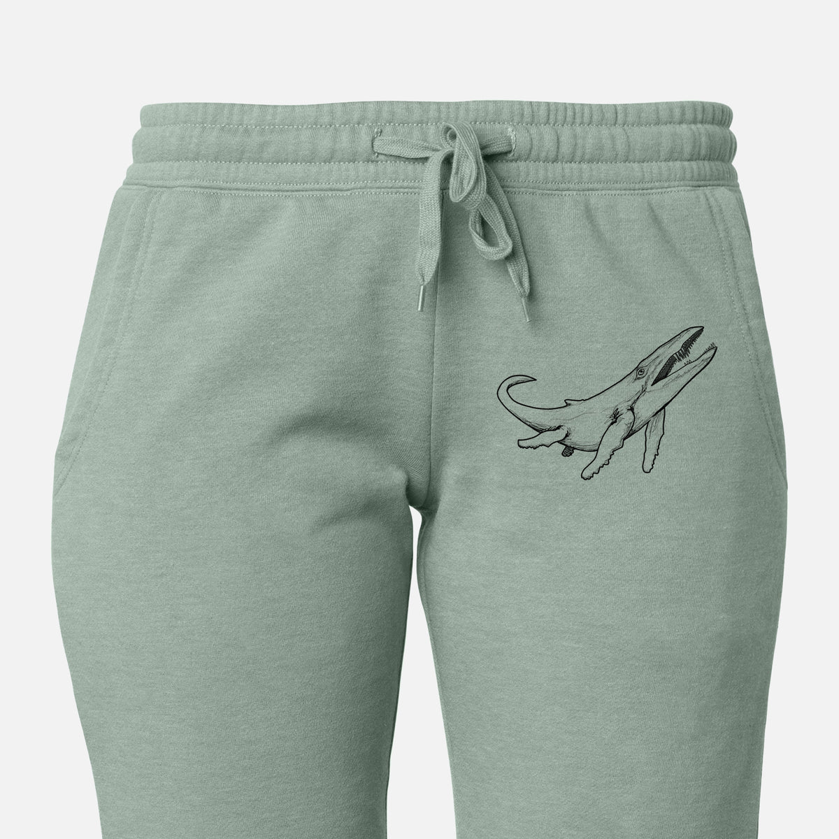 Front of sage green Cali Wave sweatpants, printed with a black ink illustration of a Kronosaurus marine reptile swimming on the leg.
