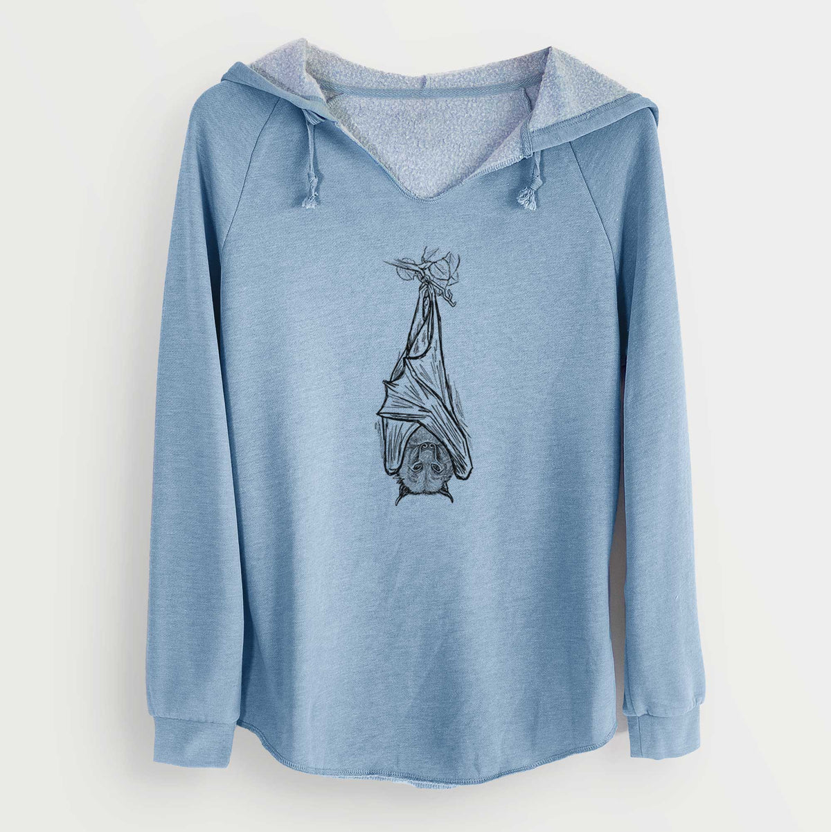 Misty blue women's Cali Wave hooded sweatshirt laid flat, printed with a black ink illustration of a large flying fox bat hanging upside down with its wings wrapped around it.