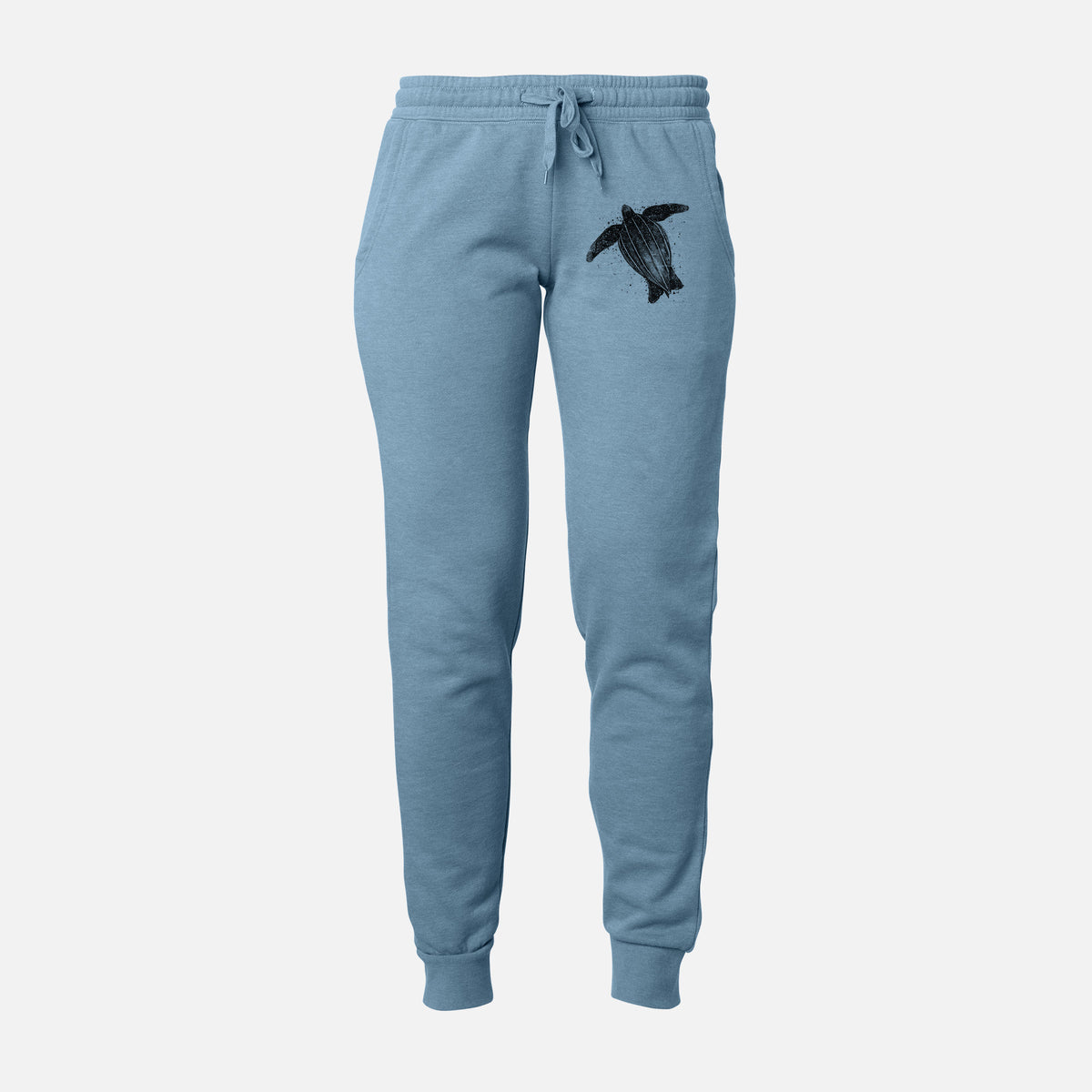 Front of misty blue Cali Wave sweatpants, printed with a black ink illustration of a leatherback sea turtle swimming, with ink splatters on the leg.