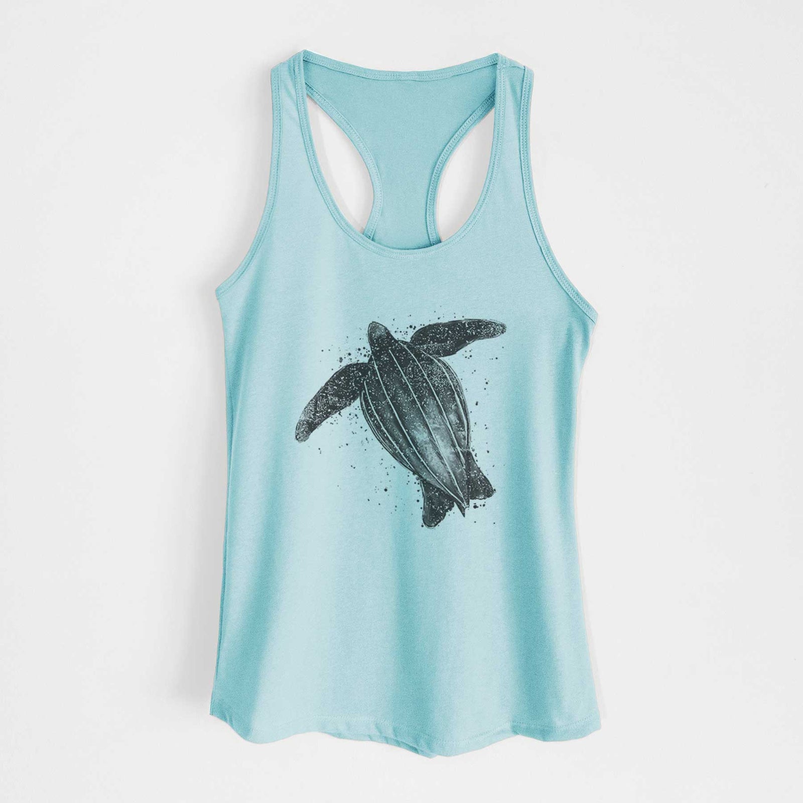 Banana cream women's racerback tank top laid flat, printed with a black ink illustration of a leatherback sea turtle swimming, with ink splatters.
