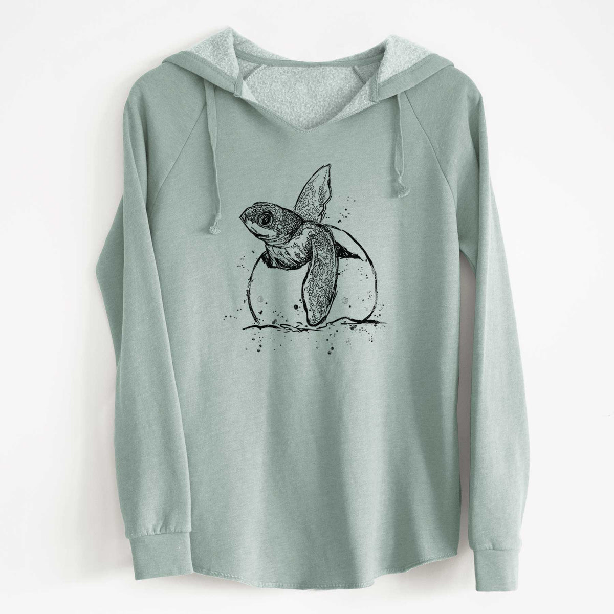Sage green women's Cali Wave hooded sweatshirt laid flat, printed with a black ink illustration of a leatherback sea turtle hatchling emerging from its egg.