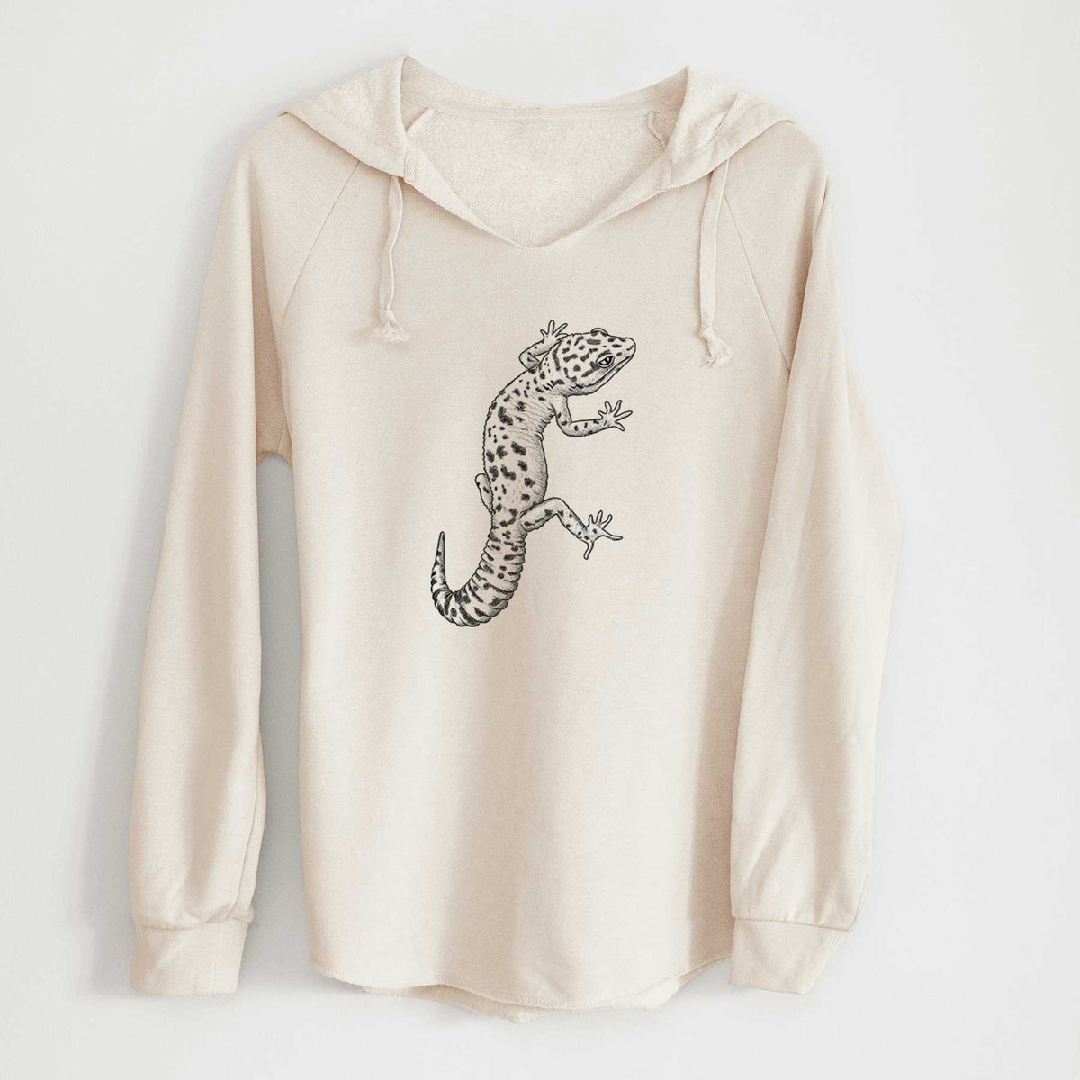 Bone cream women's Cali Wave hooded sweatshirt laid flat, printed with a detailed black ink illustration of a spotted leopard gecko climbing.