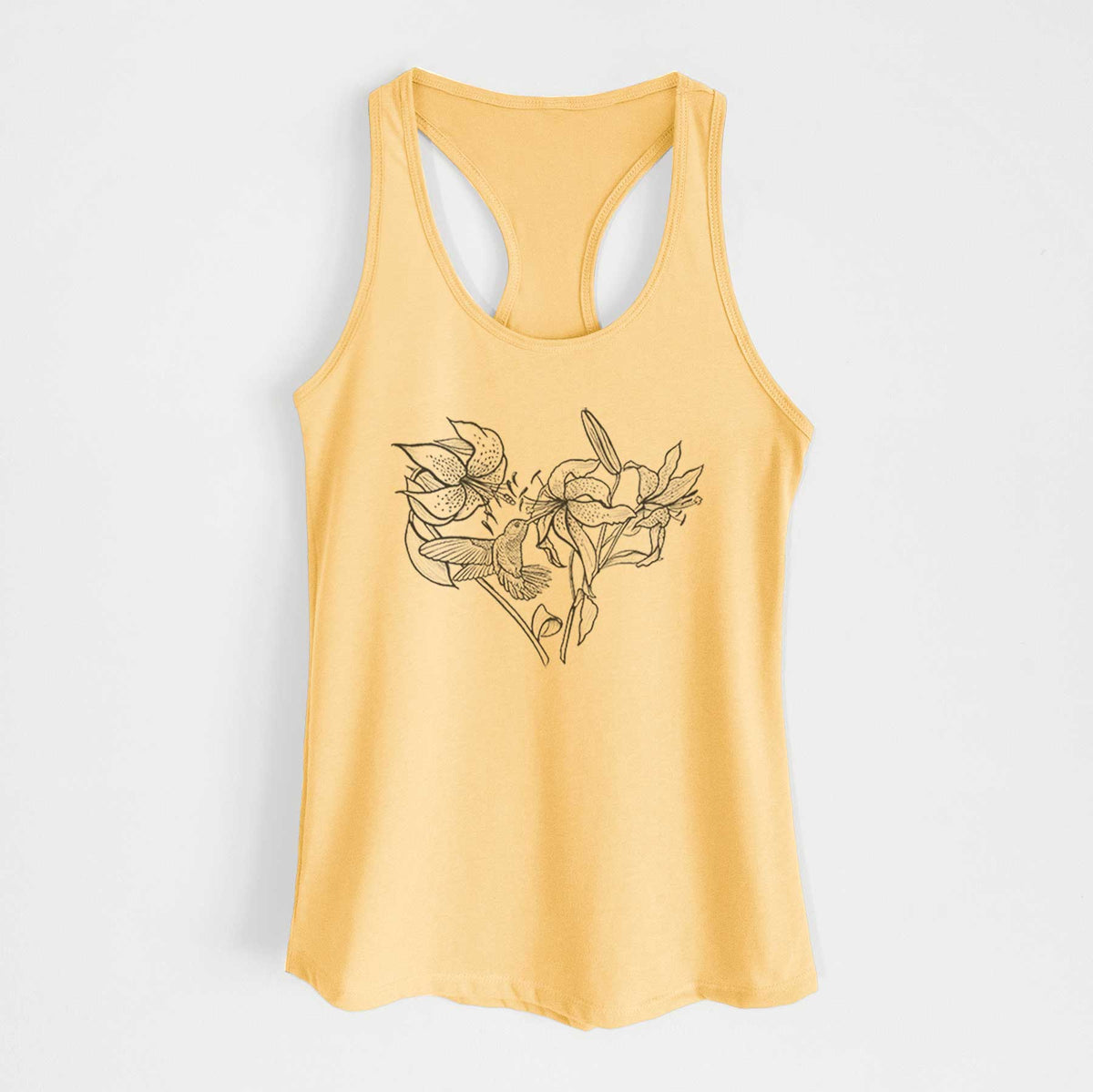 Banana cream women's racerback tank top laid flat, printed with a black ink line drawing of lilies and a hummingbird arranged in a heart shape.