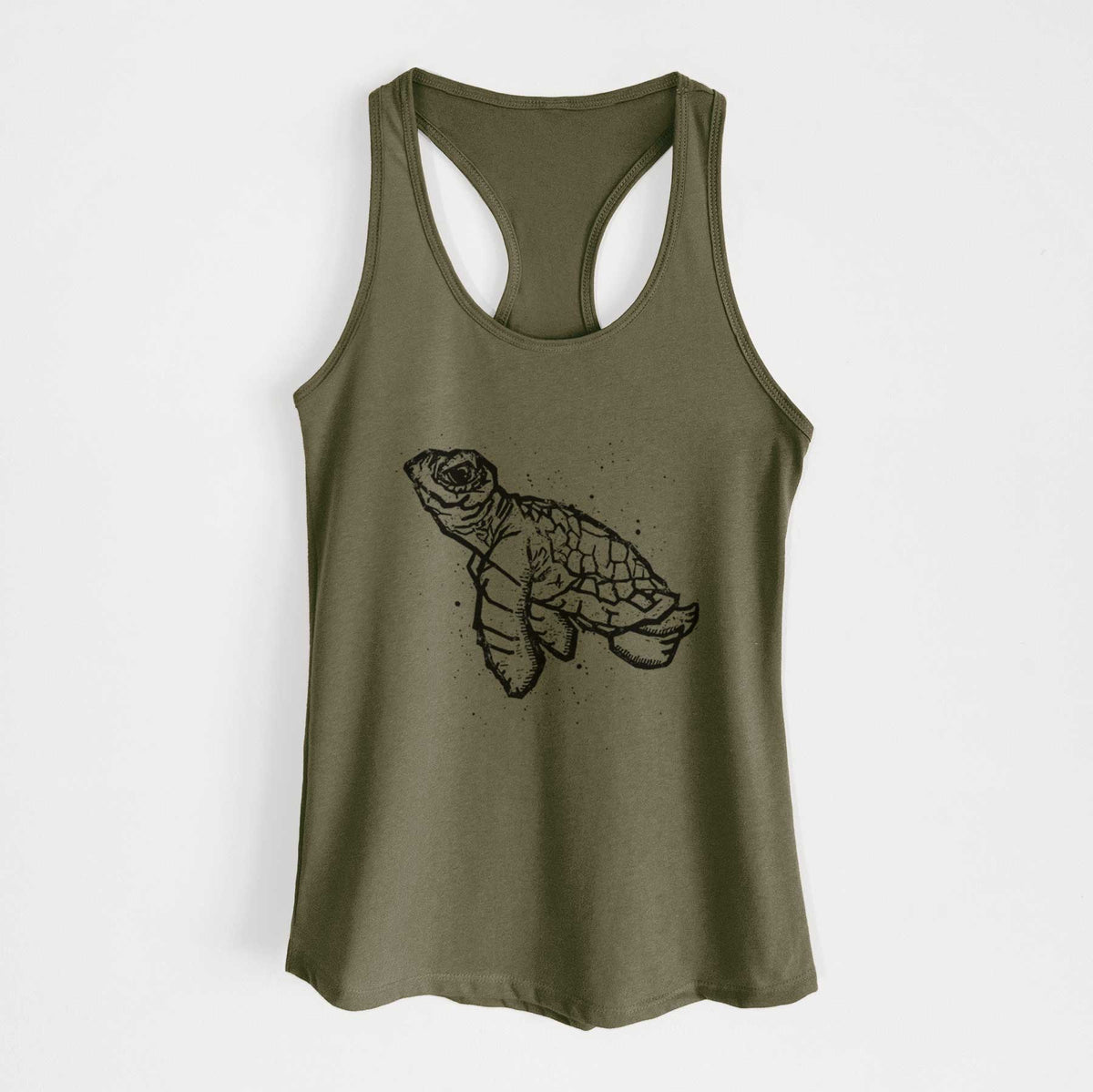 Military green women's racerback tank top laid flat, printed with a black linocut-style illustration of a baby sea turtle with a patterned shell and ink splatters.