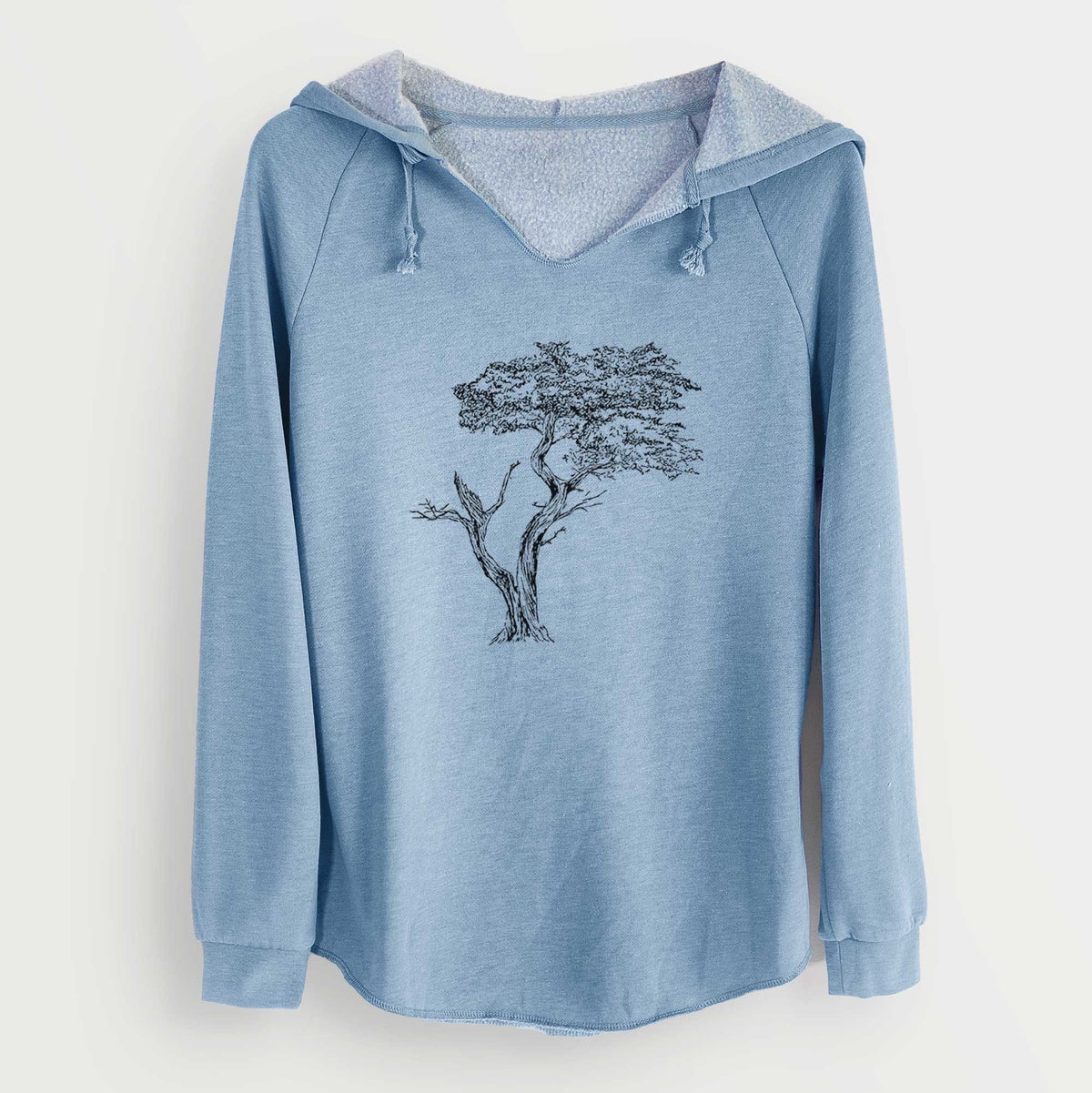 Misty blue women's Cali Wave hooded sweatshirt laid flat, printed with a black ink illustration of the windswept Lone Cypress tree on a rocky outcrop.