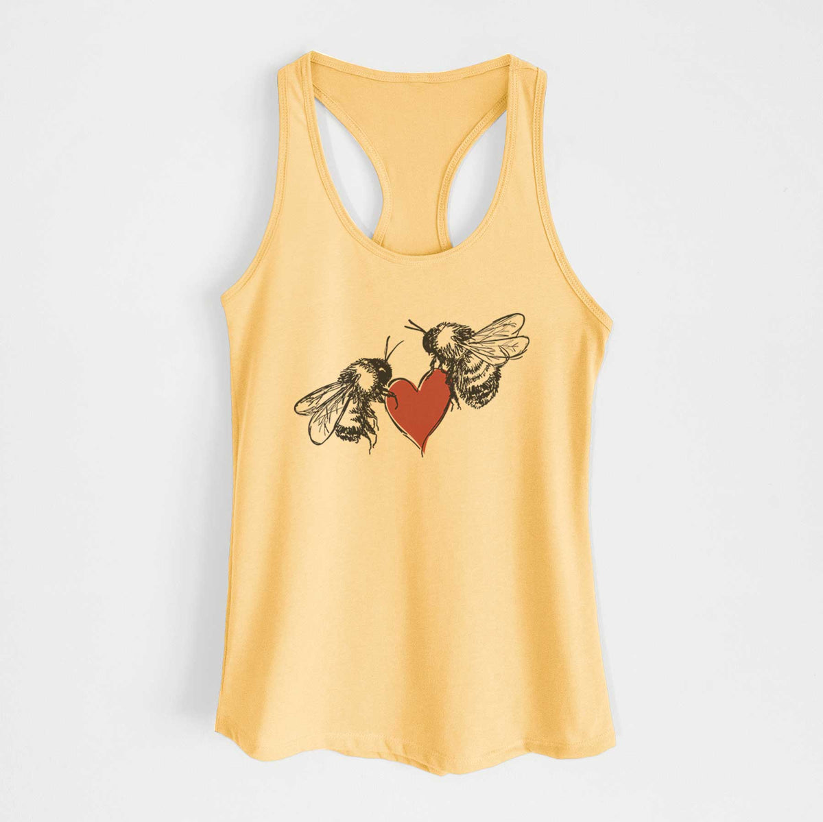 Banana cream women's racerback tank top laid flat, printed with a black ink illustration of two bees facing each other with a red heart between them.