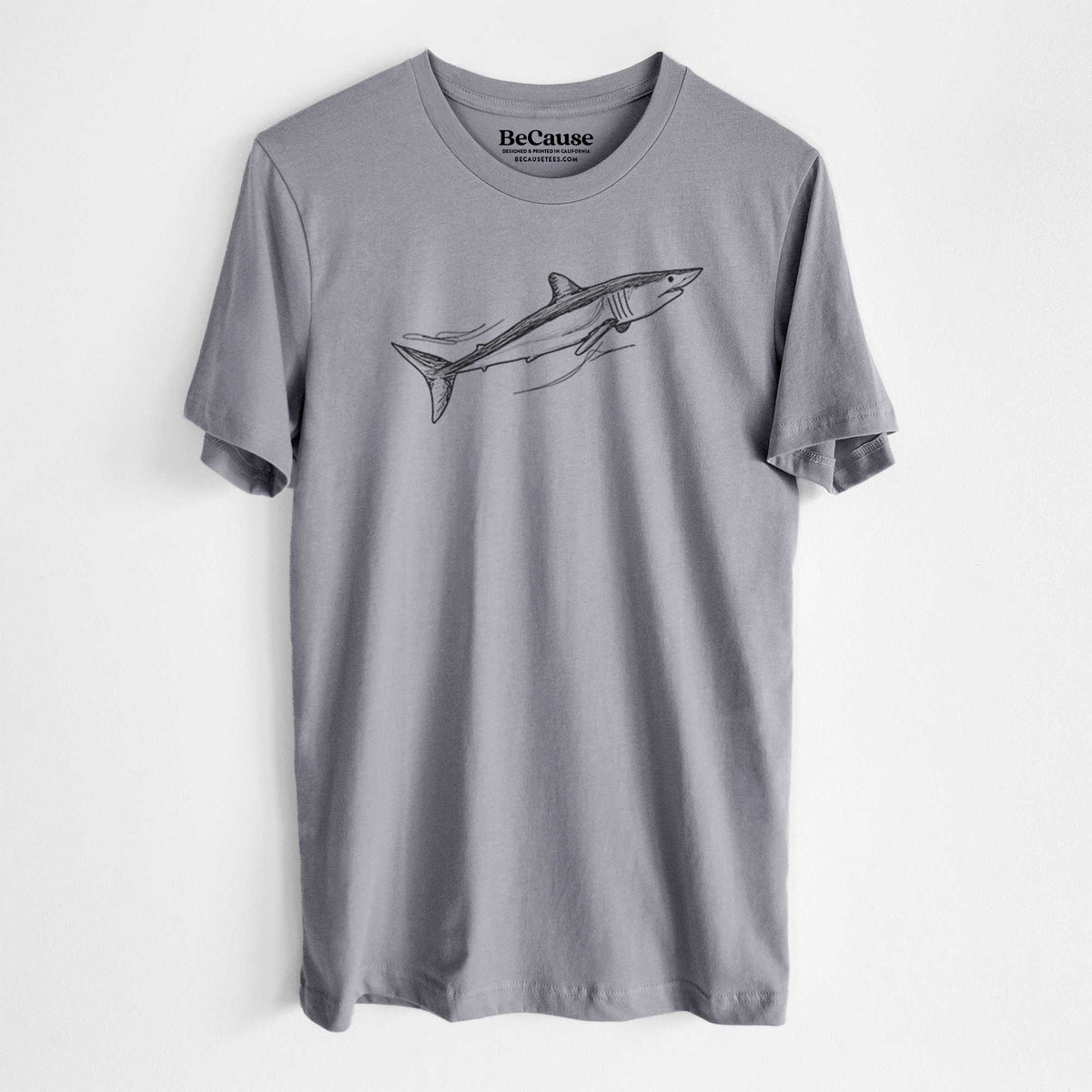 Storm grey lightweight cotton t-shirt laid flat, printed with a black ink illustration of a mako shark swimming.